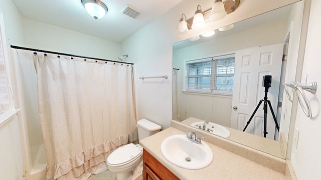106 Whitney Ave, Enterprise, AL 36330 - full bathroom with vanity, toilet, and shower / tub combo with curtain