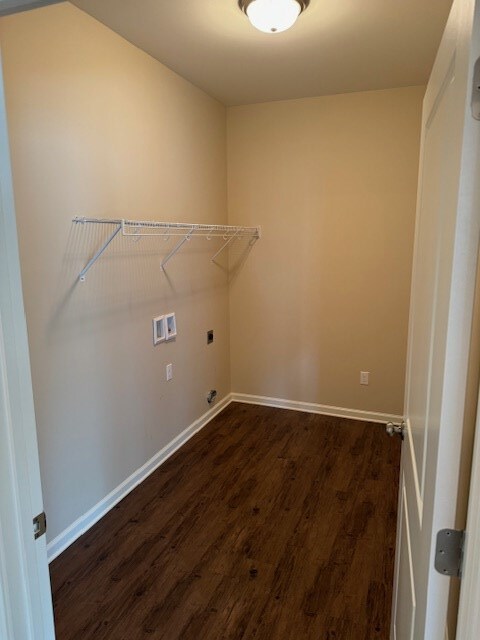 clothes washing area featuring electric dryer hookup, dark wood-type flooring, and hookup for a washing machine