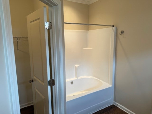 bathroom featuring hardwood / wood-style floors and shower / bathtub combination