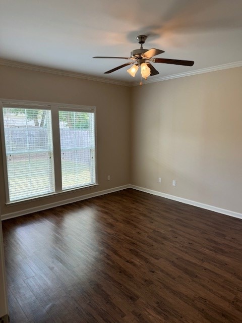 unfurnished room with dark hardwood / wood-style floors, ceiling fan, and crown molding