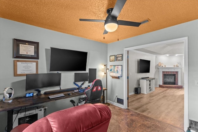 24 County Road 278, Enterprise, AL 36330 - office space featuring ceiling fan, a brick fireplace, and a textured ceiling