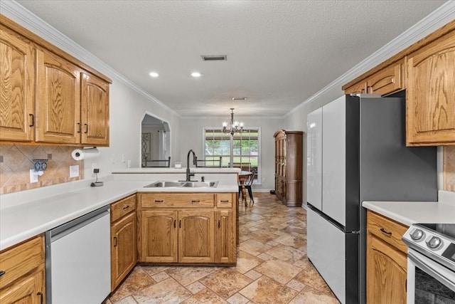 24 County Road 278, Enterprise, AL 36330 - kitchen featuring dishwasher, a sink, a chandelier, a peninsula, and crown molding