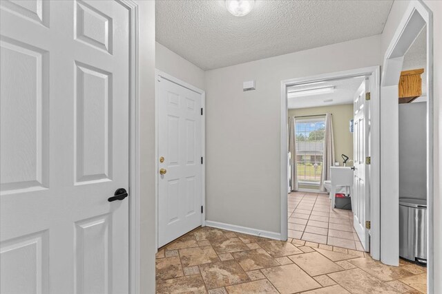 24 County Road 278, Enterprise, AL 36330 - entrance foyer featuring a textured ceiling and baseboards