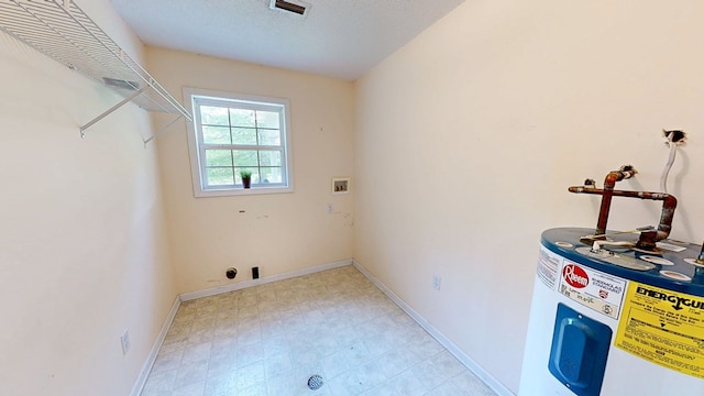 laundry room with washer hookup, laundry area, visible vents, water heater, and baseboards