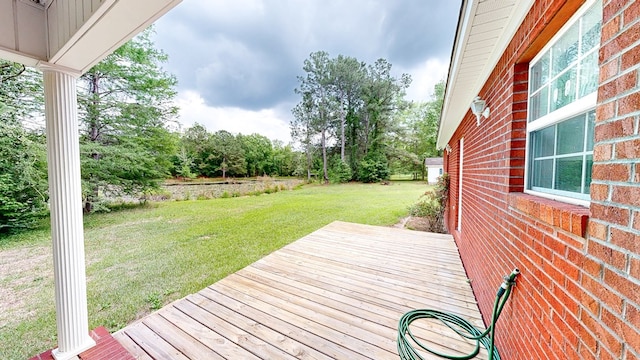 wooden deck with a yard