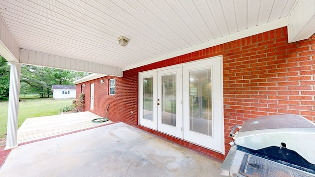 view of patio with area for grilling and french doors