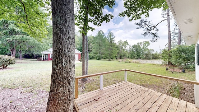 wooden deck with a lawn