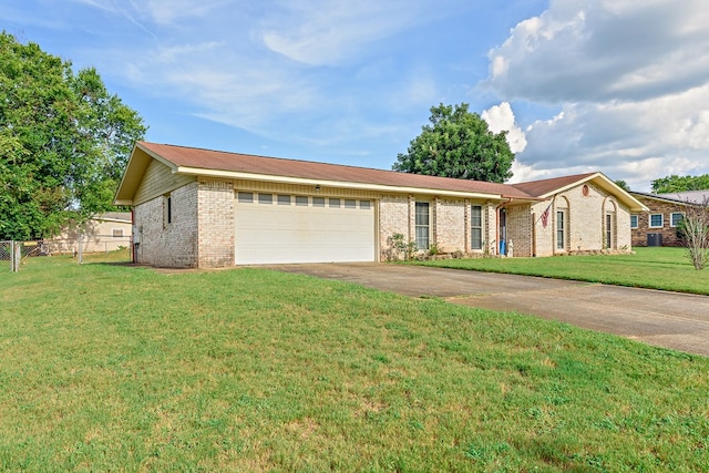 single story home featuring brick siding, an attached garage, a front yard, fence, and driveway