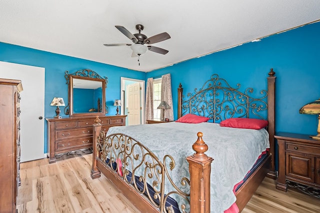 bedroom featuring light wood-style floors and a ceiling fan