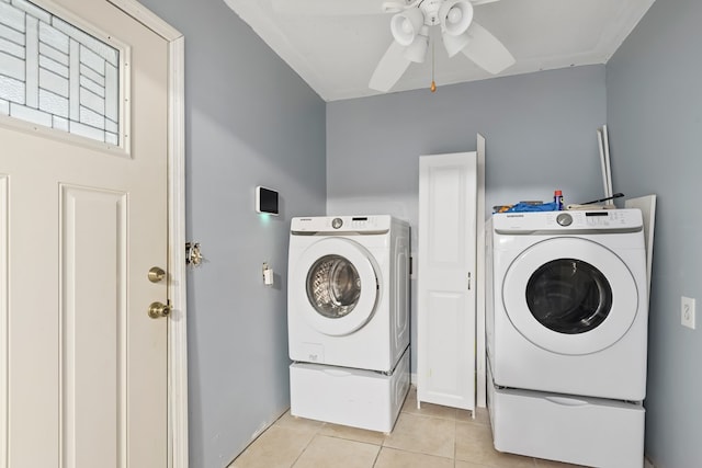 washroom with light tile patterned floors, laundry area, and a ceiling fan