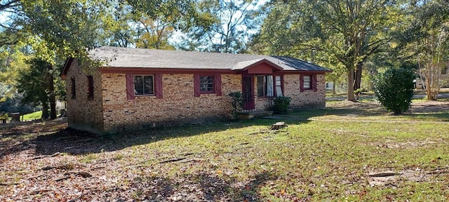 ranch-style house with a front lawn