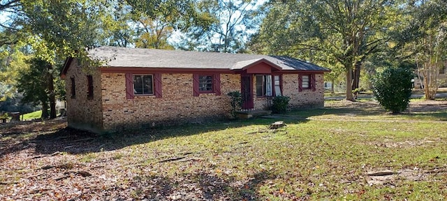1300 Bruce St, Dothan, AL 36301 - ranch-style house with brick siding and a front yard