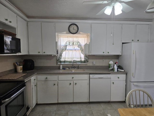 kitchen with decorative backsplash, white cabinetry, white appliances, and sink