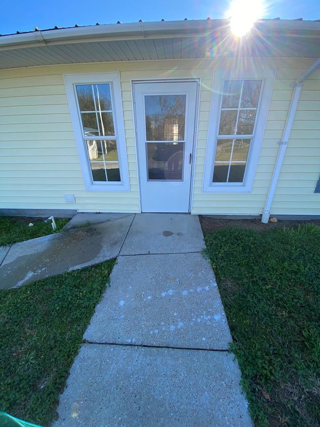 entrance to property with a patio area