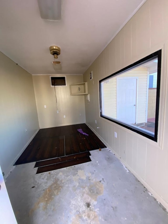 spare room featuring wood-type flooring