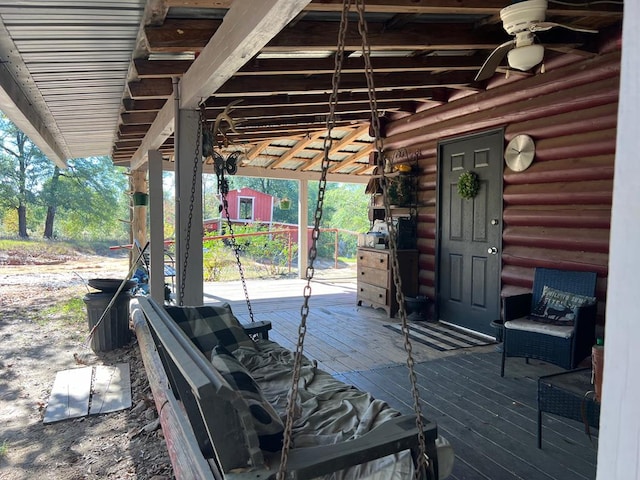 view of patio / terrace featuring ceiling fan and a wooden deck