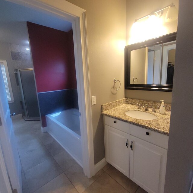 6325 State Highway 95, Abbeville, AL 36310 - full bath with vanity, tile patterned flooring, a garden tub, and a shower stall