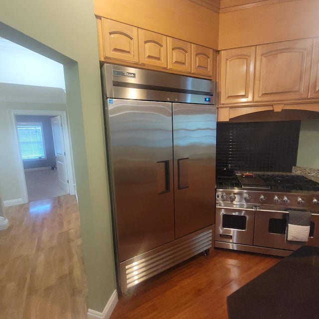 6325 State Highway 95, Abbeville, AL 36310 - kitchen featuring high quality appliances, wood finished floors, and tasteful backsplash