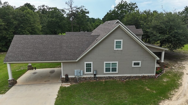 6325 State Highway 95, Abbeville, AL 36310 - view of front of house with driveway, a front lawn, a carport, and a shingled roof