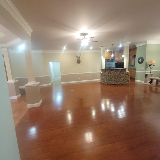 6325 State Highway 95, Abbeville, AL 36310 - living room featuring decorative columns, crown molding, ceiling fan, and wood finished floors