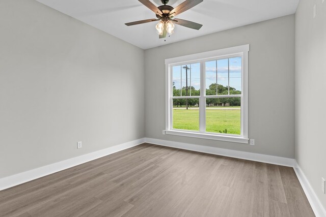45 County Road 711, Enterprise, AL 36330 - spare room featuring wood finished floors, baseboards, and a ceiling fan
