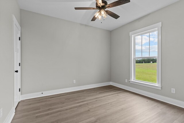 45 County Road 711, Enterprise, AL 36330 - empty room with wood finished floors, a ceiling fan, and baseboards