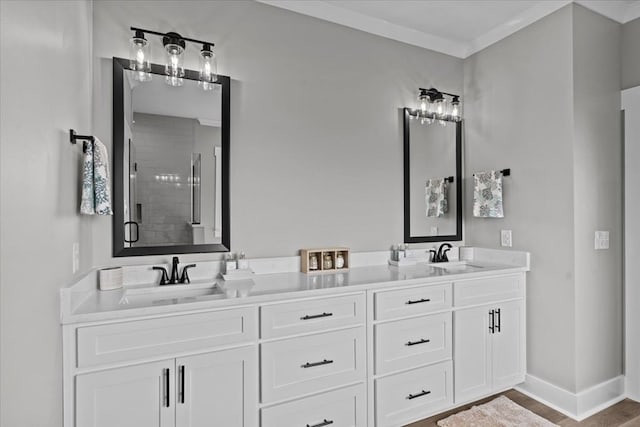 45 County Road 711, Enterprise, AL 36330 - bathroom with a shower stall, double vanity, baseboards, and wood finished floors