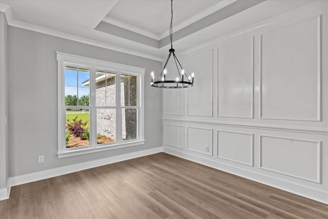 45 County Road 711, Enterprise, AL 36330 - unfurnished dining area with a chandelier, dark wood-type flooring, baseboards, crown molding, and a tray ceiling