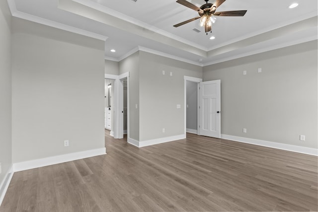 45 County Road 711, Enterprise, AL 36330 - empty room featuring a raised ceiling, recessed lighting, a ceiling fan, wood finished floors, and ornamental molding