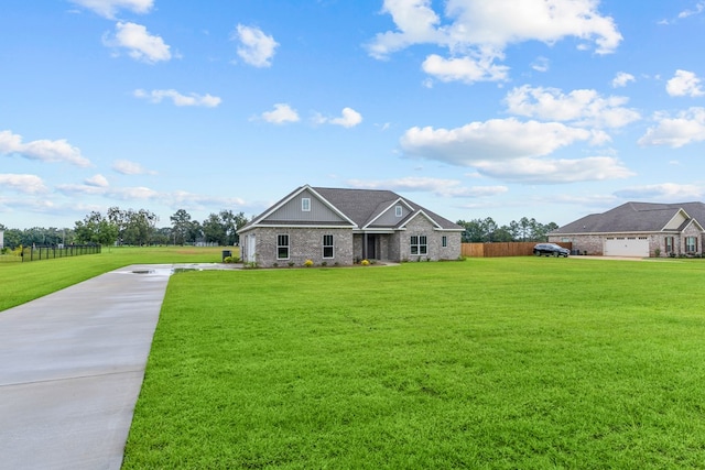 45 County Road 711, Enterprise, AL 36330 - view of front of home with board and batten siding, concrete driveway, and brick siding