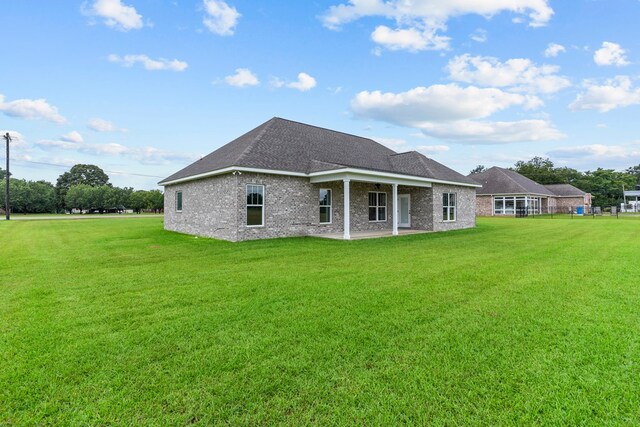 45 County Road 711, Enterprise, AL 36330 - rear view of property with a patio area, a lawn, and brick siding