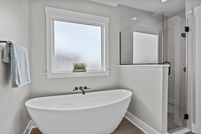 45 County Road 711, Enterprise, AL 36330 - bathroom featuring baseboards, a stall shower, and a soaking tub