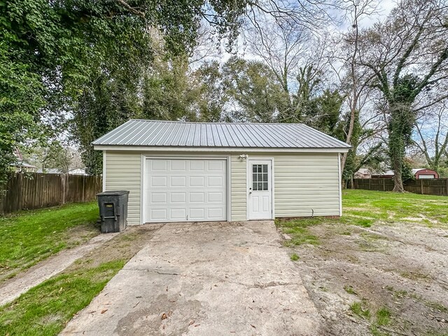 garage with a yard