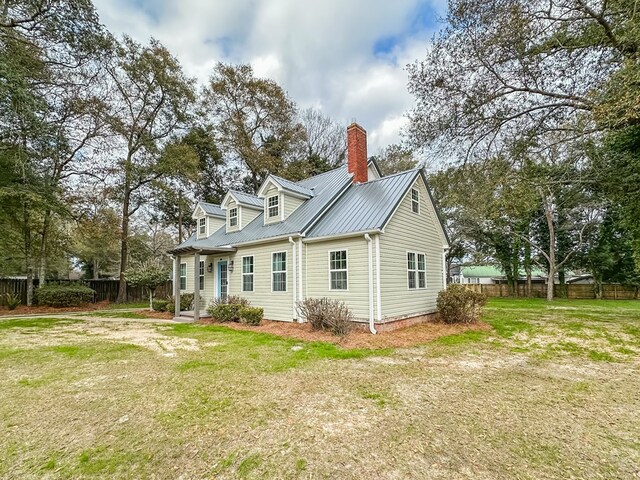 rear view of house with a lawn