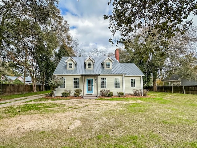 new england style home featuring a front yard