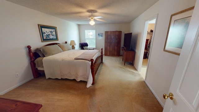 166 Candle Brook Dr, Dothan, AL 36303 - bedroom featuring light carpet, baseboards, ceiling fan, and a textured ceiling
