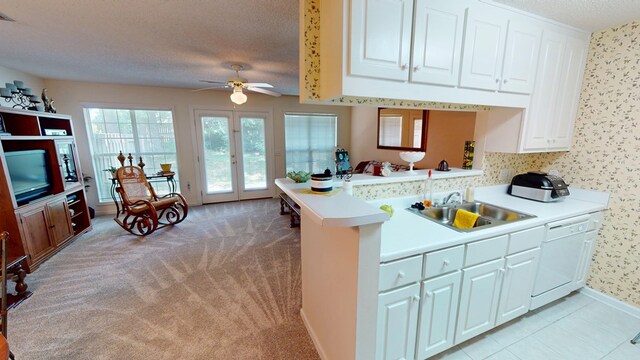 166 Candle Brook Dr, Dothan, AL 36303 - kitchen featuring dishwasher, a textured ceiling, light countertops, ceiling fan, and white cabinetry