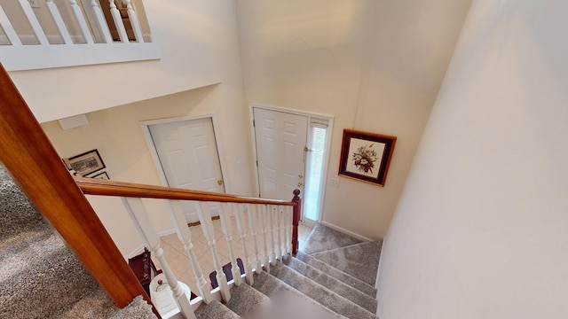 166 Candle Brook Dr, Dothan, AL 36303 - staircase featuring a high ceiling, carpet flooring, and baseboards