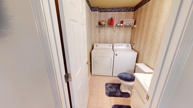 166 Candle Brook Dr, Dothan, AL 36303 - laundry area featuring washing machine and dryer and light tile patterned flooring