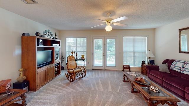 166 Candle Brook Dr, Dothan, AL 36303 - living area with light colored carpet, a textured ceiling, and a ceiling fan