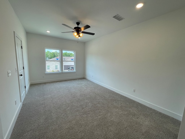 spare room featuring a ceiling fan, carpet flooring, baseboards, and recessed lighting