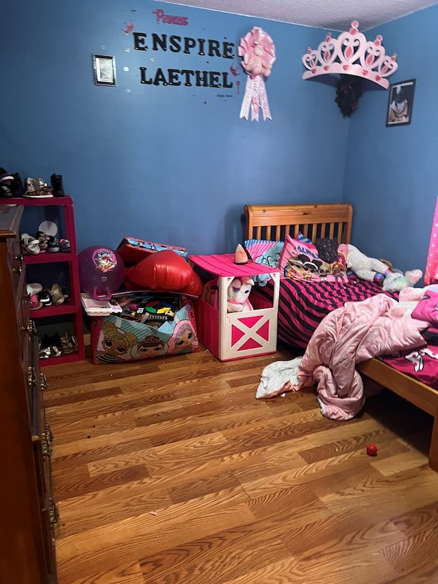 bedroom featuring wood-type flooring