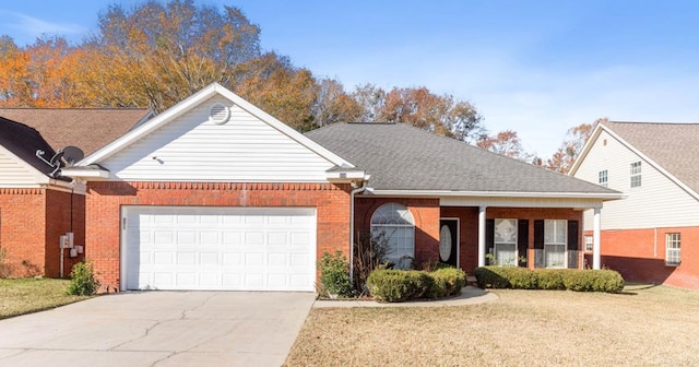 view of front of property with a garage and a front lawn