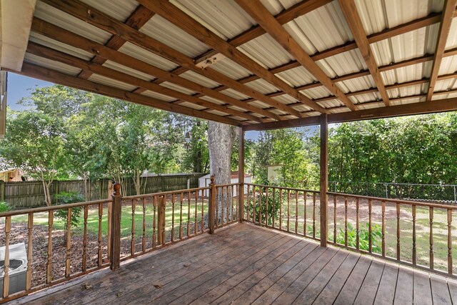 1571 Denton Rd, Dothan, AL 36303 - deck with a fenced backyard, a storage unit, and view of scattered trees