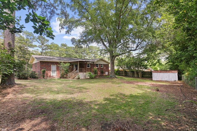 1571 Denton Rd, Dothan, AL 36303 - fenced backyard featuring a storage shed