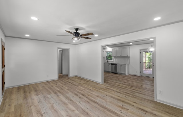 1571 Denton Rd, Dothan, AL 36303 - unfurnished living room featuring light wood-type flooring, ceiling fan, recessed lighting, and ornamental molding
