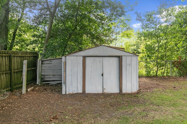 1571 Denton Rd, Dothan, AL 36303 - view of shed with a fenced backyard and view of wooded area
