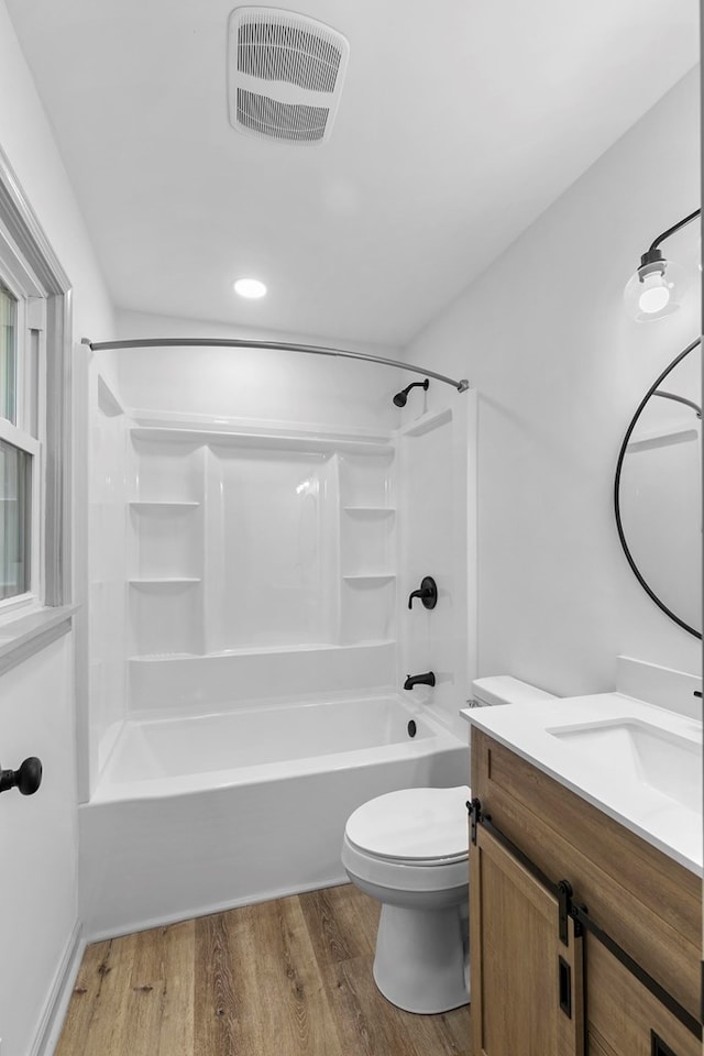 1571 Denton Rd, Dothan, AL 36303 - full bathroom featuring vanity, wood finished floors, and  shower combination