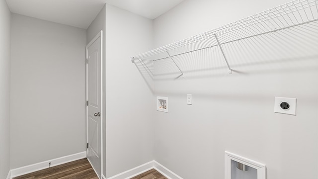 laundry room featuring dark wood-style floors, hookup for a washing machine, hookup for an electric dryer, laundry area, and baseboards