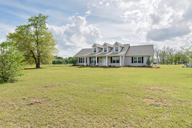 cape cod home with a front yard and a porch